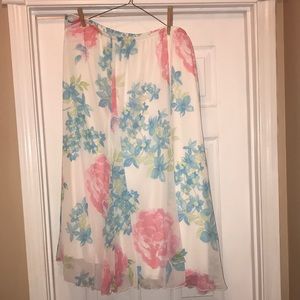 Ruby RD. Skirt size 2x. Pink and flowers with green leaves on white background.